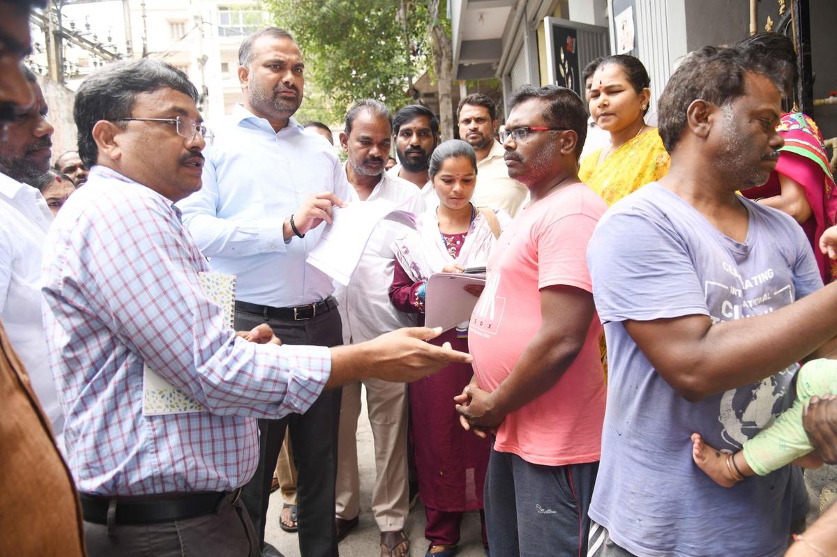 District Election Officer and Greater Hyderabad Municipal Corporation Commissioner R.V. Karnan inspecting distribution of the enumeration forms by the Booth Level Officers in the city on Thursday.